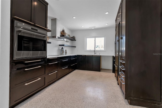 130 N Adams Dr, Sarasota, FL 34236 - kitchen featuring oven, wall chimney exhaust hood, light countertops, dark aggregate flooring, and open shelves