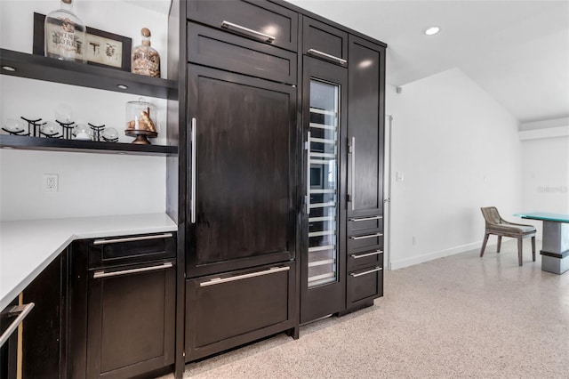130 N Adams Dr, Sarasota, FL 34236 - bar with dark aggregate flooring, baseboards, recessed lighting, and paneled built in refrigerator