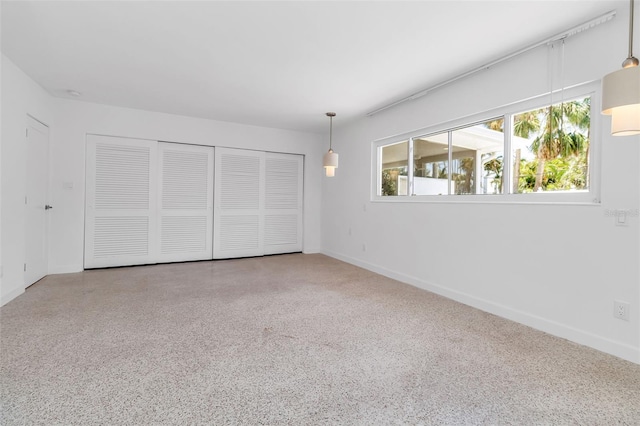 130 N Adams Dr, Sarasota, FL 34236 - unfurnished bedroom with baseboards and a closet