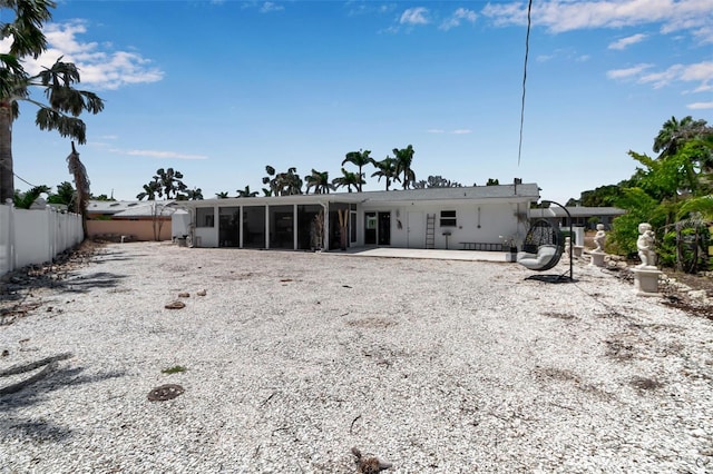 130 N Adams Dr, Sarasota, FL 34236 - back of house featuring a sunroom and a patio
