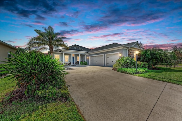 1219 Thornbury Dr, Parrish, FL 34219 - ranch-style house featuring stucco siding, a garage, and concrete driveway