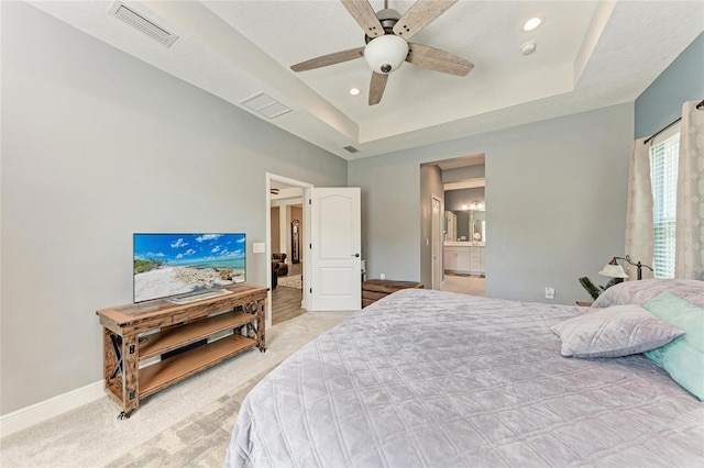 1219 Thornbury Dr, Parrish, FL 34219 - bedroom featuring light colored carpet, a tray ceiling, baseboards, ceiling fan, and recessed lighting