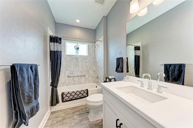 1219 Thornbury Dr, Parrish, FL 34219 - bathroom with vanity, shower / tub combo with curtain, toilet, wood finished floors, and baseboards