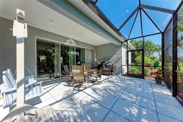 1219 Thornbury Dr, Parrish, FL 34219 - view of patio / terrace with glass enclosure and outdoor dining space