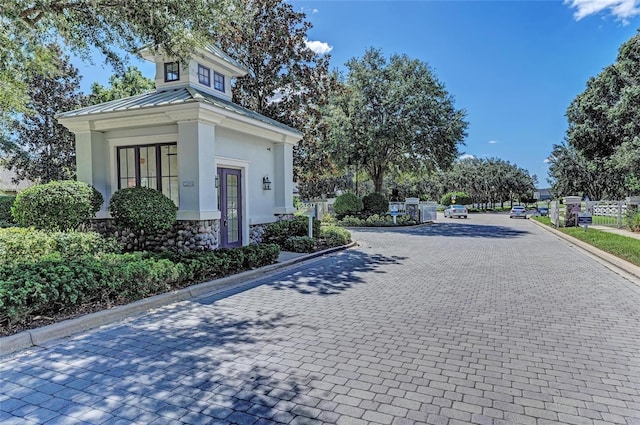 1219 Thornbury Dr, Parrish, FL 34219 - view of road with curbs and a gated entry