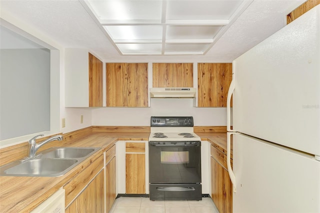 933 Sunridge Way Unit B5, Sarasota, FL 34234 - kitchen with white appliances, under cabinet range hood, and light tile patterned flooring