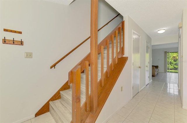933 Sunridge Way Unit B5, Sarasota, FL 34234 - stairs with tile patterned floors and baseboards