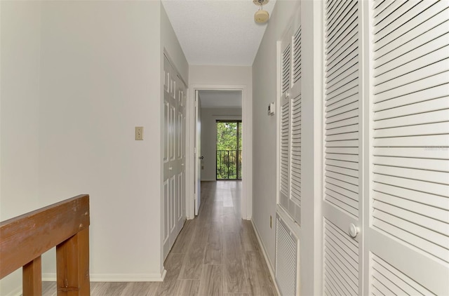 933 Sunridge Way Unit B5, Sarasota, FL 34234 - corridor featuring baseboards and light wood-type flooring