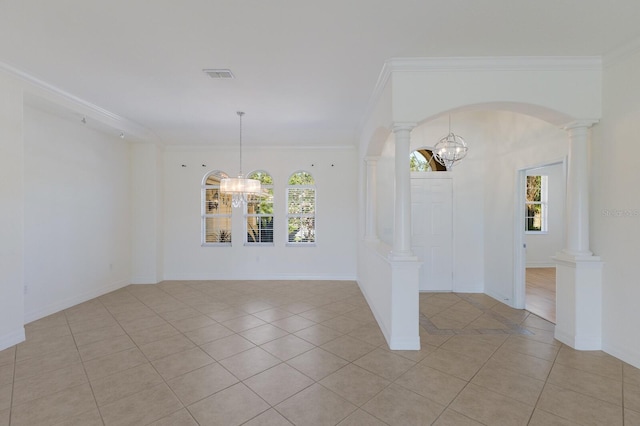 9719 Discovery Ter, Bradenton, FL 34212 - spare room featuring a chandelier, plenty of natural light, light tile patterned flooring, and crown molding