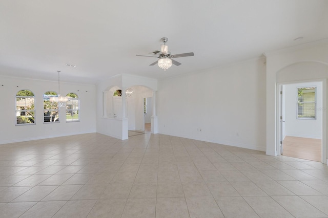 9719 Discovery Ter, Bradenton, FL 34212 - unfurnished room with arched walkways, ceiling fan, ornamental molding, and light tile patterned flooring