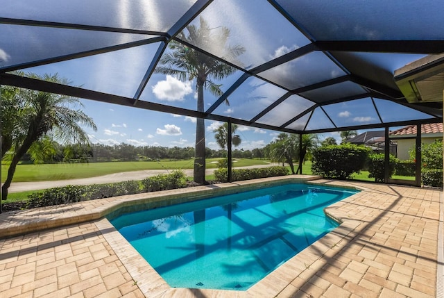 9719 Discovery Ter, Bradenton, FL 34212 - swimming pool featuring a patio area, golf course view, and glass enclosure