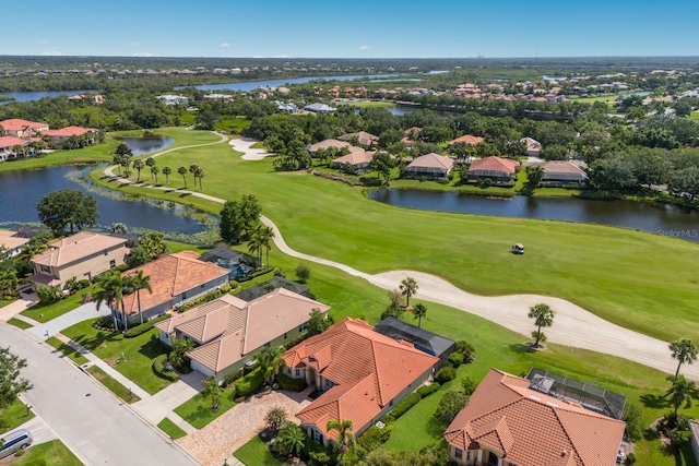 9719 Discovery Ter, Bradenton, FL 34212 - aerial perspective of suburban area featuring a golf club and a nearby body of water