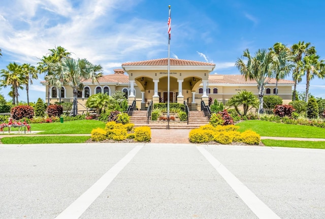 9719 Discovery Ter, Bradenton, FL 34212 - view of building exterior featuring stairs and uncovered parking