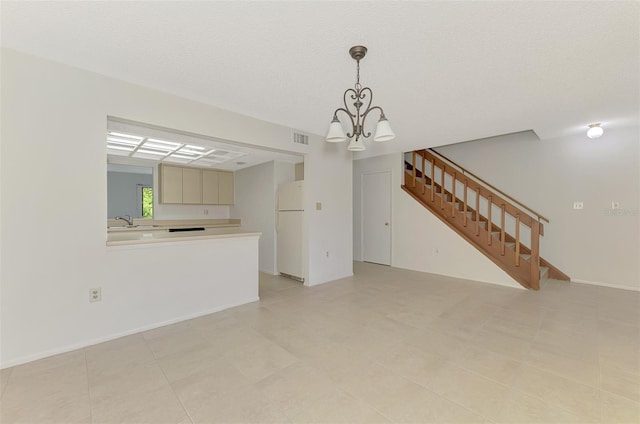 935 Sunridge Way Unit B4, Sarasota, FL 34234 - unfurnished living room featuring stairway and a chandelier