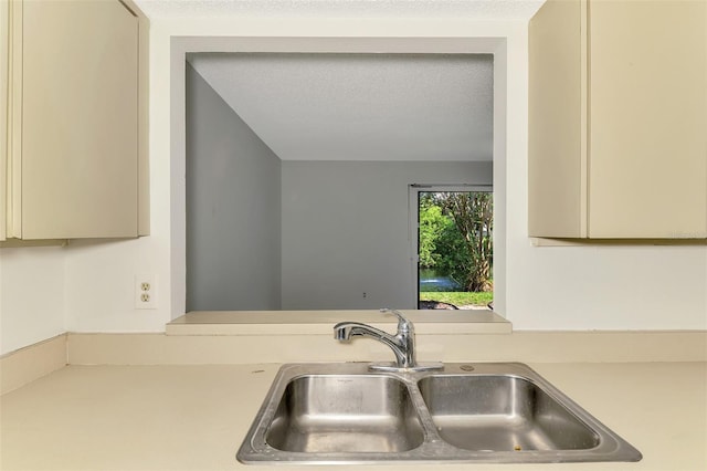 935 Sunridge Way Unit B4, Sarasota, FL 34234 - kitchen featuring light countertops and cream cabinets