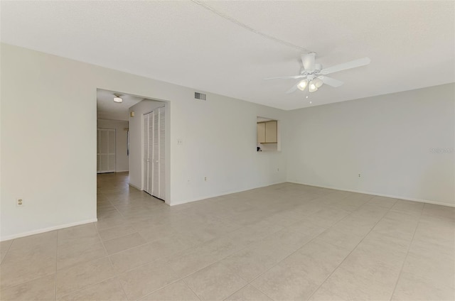 935 Sunridge Way Unit B4, Sarasota, FL 34234 - spare room featuring ceiling fan and light tile patterned floors
