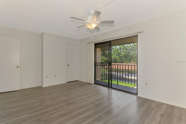 935 Sunridge Way Unit B4, Sarasota, FL 34234 - spare room featuring wood finished floors and a ceiling fan