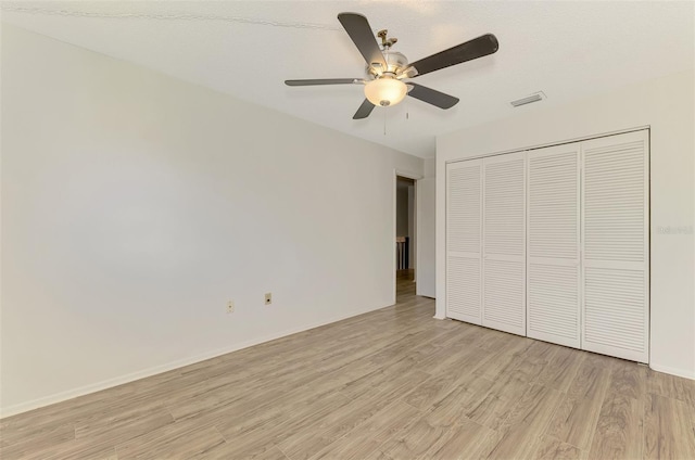 935 Sunridge Way Unit B4, Sarasota, FL 34234 - unfurnished bedroom with light wood-style flooring, a closet, and ceiling fan