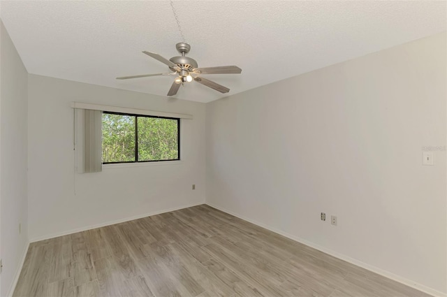 935 Sunridge Way Unit B4, Sarasota, FL 34234 - empty room featuring light wood-style flooring, a ceiling fan, and a textured ceiling