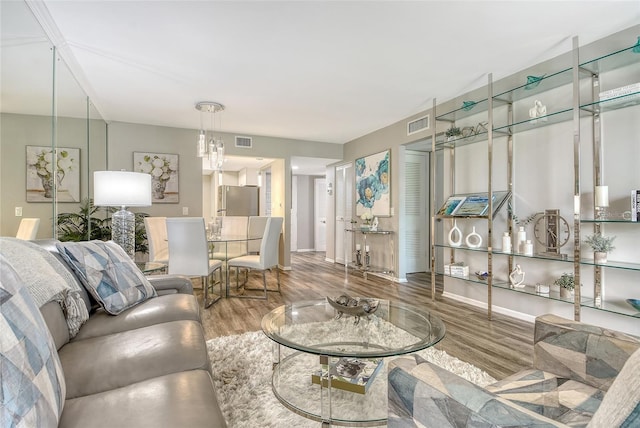 2055 Gulf Of Mexico Dr Unit G2-108, Longboat Key, FL 34228 - living room with wood finished floors and baseboards