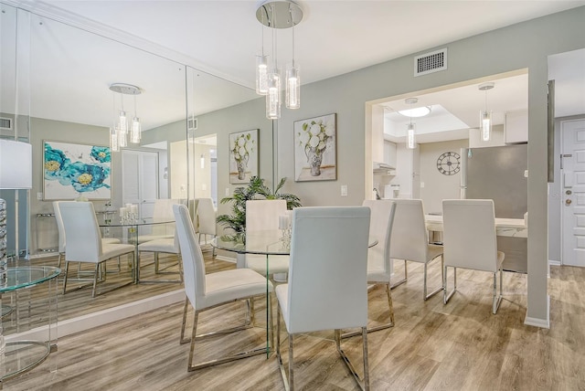 2055 Gulf Of Mexico Dr Unit G2-108, Longboat Key, FL 34228 - dining area with wood finished floors