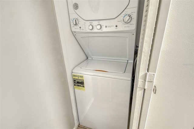 2055 Gulf Of Mexico Dr Unit G2-108, Longboat Key, FL 34228 - washroom featuring stacked washer and clothes dryer