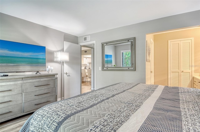 2055 Gulf Of Mexico Dr Unit G2-108, Longboat Key, FL 34228 - bedroom featuring wood finished floors