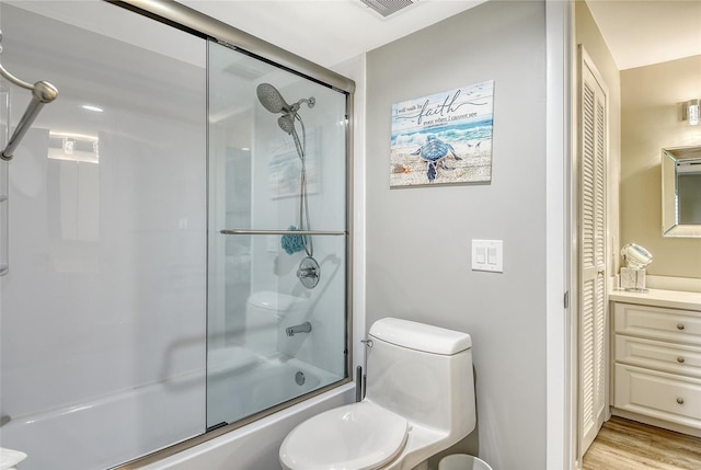 2055 Gulf Of Mexico Dr Unit G2-108, Longboat Key, FL 34228 - bathroom featuring enclosed tub / shower combo, a closet, and wood finished floors
