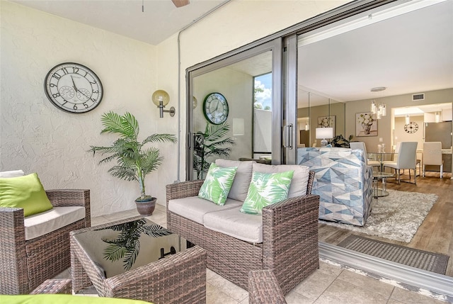 2055 Gulf Of Mexico Dr Unit G2-108, Longboat Key, FL 34228 - living area with a chandelier and wood finished floors