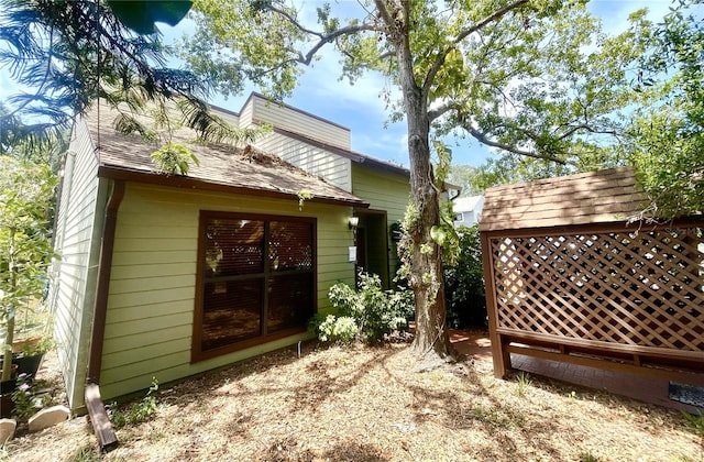 4042 S Lockwood Ridge Rd, Sarasota, FL 34231 - view of side of home with a shingled roof