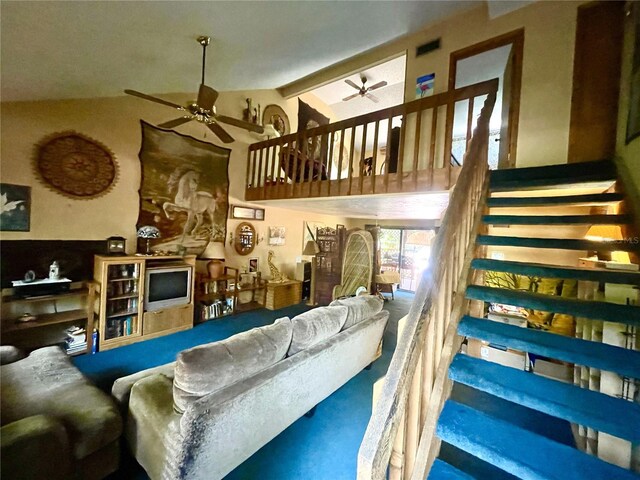 4042 S Lockwood Ridge Rd, Sarasota, FL 34231 - living room with a ceiling fan, stairway, carpet floors, and high vaulted ceiling