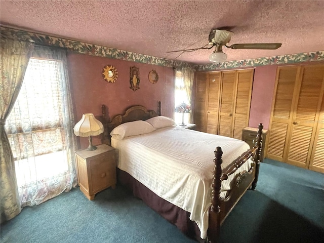 4042 S Lockwood Ridge Rd, Sarasota, FL 34231 - bedroom featuring carpet, a textured ceiling, multiple closets, and a ceiling fan