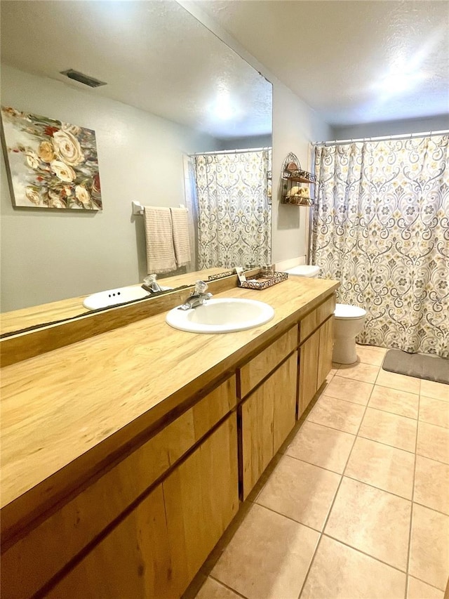 4042 S Lockwood Ridge Rd, Sarasota, FL 34231 - full bath with toilet, vanity, tile patterned flooring, and a shower with curtain