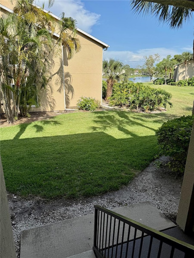 4037 Crockers Lake Blvd Unit 24, Sarasota, FL 34238 - view of grassy yard with a water view