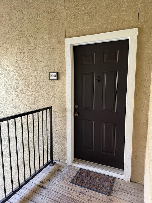 4037 Crockers Lake Blvd Unit 24, Sarasota, FL 34238 - view of exterior entry featuring stucco siding