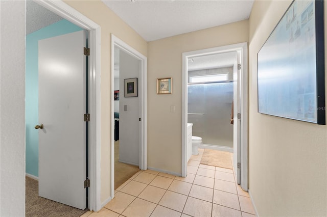 712 68th Ave W, Bradenton, FL 34207 - hallway with baseboards and light tile patterned flooring