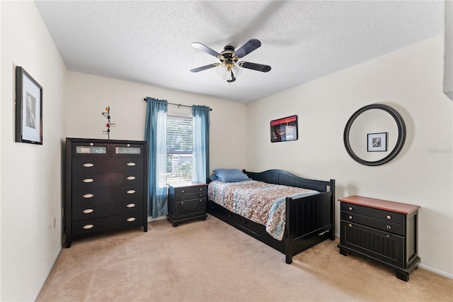 712 68th Ave W, Bradenton, FL 34207 - bedroom with light carpet, a textured ceiling, and ceiling fan