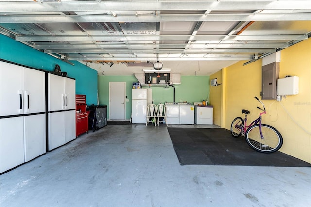 712 68th Ave W, Bradenton, FL 34207 - garage with freestanding refrigerator, washer and dryer, and electric panel