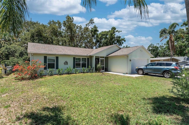 712 68th Ave W, Bradenton, FL 34207 - ranch-style house with an attached garage, a front yard, and stucco siding
