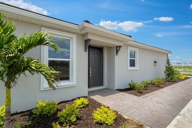 3204 Torta Ct, Bradenton, FL 34211 - doorway to property with stucco siding