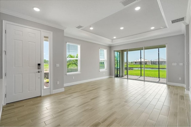 3204 Torta Ct, Bradenton, FL 34211 - entrance foyer with ornamental molding, plenty of natural light, a raised ceiling, light wood-style floors, and recessed lighting