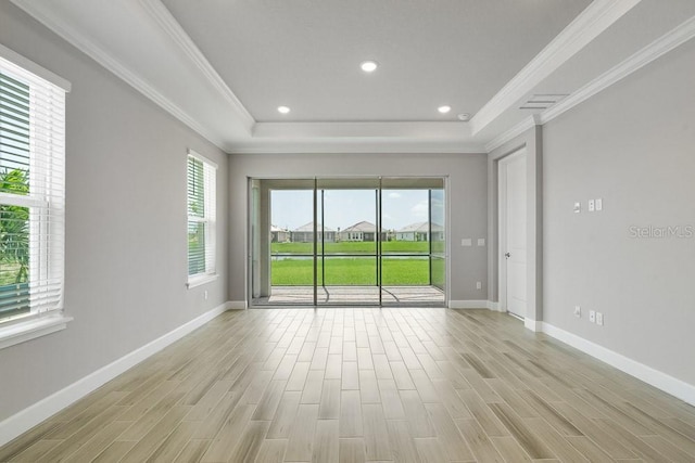 3204 Torta Ct, Bradenton, FL 34211 - empty room with light wood-type flooring, a tray ceiling, ornamental molding, and recessed lighting