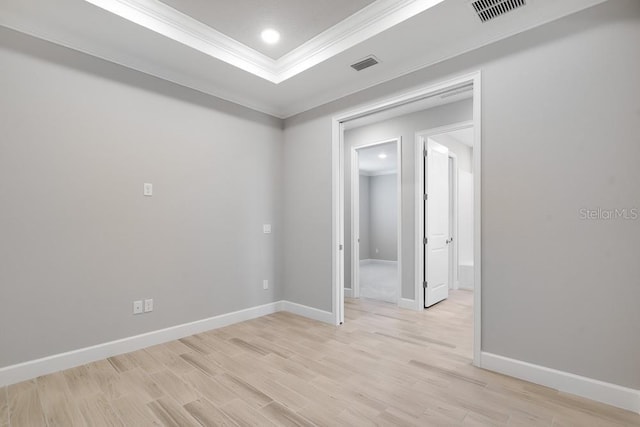 3204 Torta Ct, Bradenton, FL 34211 - unfurnished room with ornamental molding, a tray ceiling, light wood-style floors, and recessed lighting