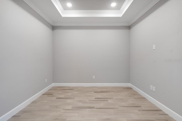 3204 Torta Ct, Bradenton, FL 34211 - spare room featuring crown molding, a raised ceiling, light wood-style flooring, and recessed lighting
