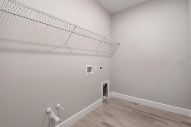 3204 Torta Ct, Bradenton, FL 34211 - laundry area with washer hookup, light wood-type flooring, hookup for an electric dryer, and hookup for a gas dryer