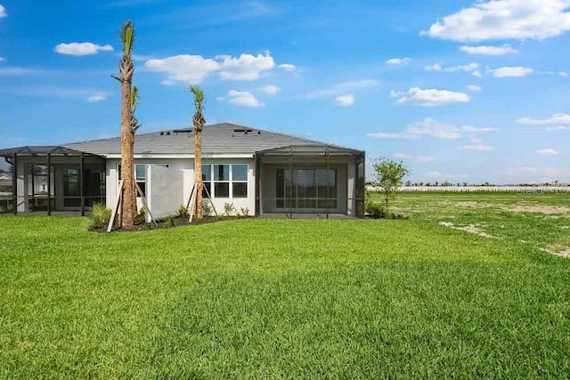 3204 Torta Ct, Bradenton, FL 34211 - rear view of property featuring a lawn and a sunroom