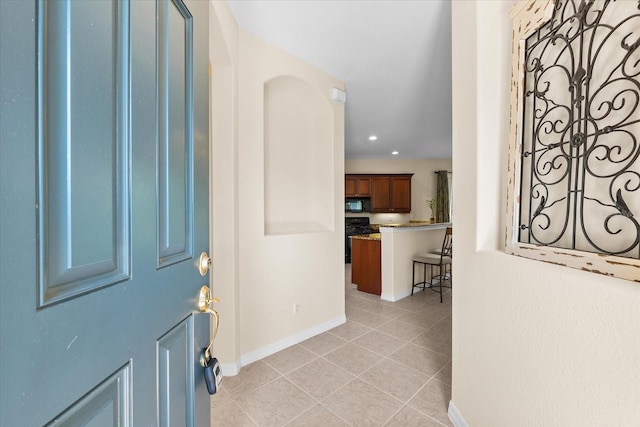 138 Tiziano Way N, Venice, FL 34275 - foyer entrance featuring light tile patterned floors, baseboards, and recessed lighting