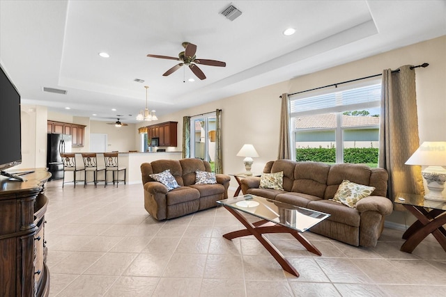 138 Tiziano Way N, Venice, FL 34275 - living area with a tray ceiling, a ceiling fan, light tile patterned flooring, and recessed lighting
