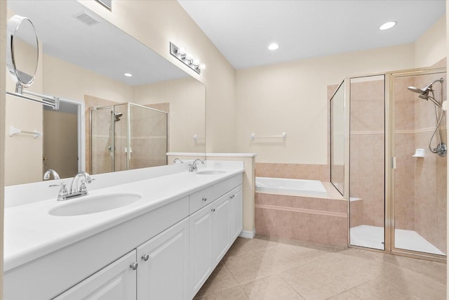 138 Tiziano Way N, Venice, FL 34275 - bathroom with double vanity, a shower stall, a bath, tile patterned floors, and recessed lighting
