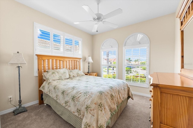 138 Tiziano Way N, Venice, FL 34275 - bedroom with light carpet, baseboards, and a ceiling fan